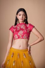 Mustard yellow lehenga with contrasting rani pink blouse