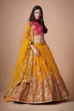Mustard yellow and rani pink mirror work designer lehenga choli