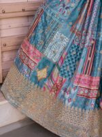 Sky blue chiffon dupatta with golden scalloped edging and embroidered details